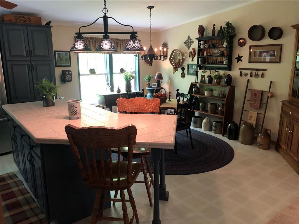 661 Nelson Road Farmington, PA 15437 - Photo 19 of 50 a view of a dining room with furniture