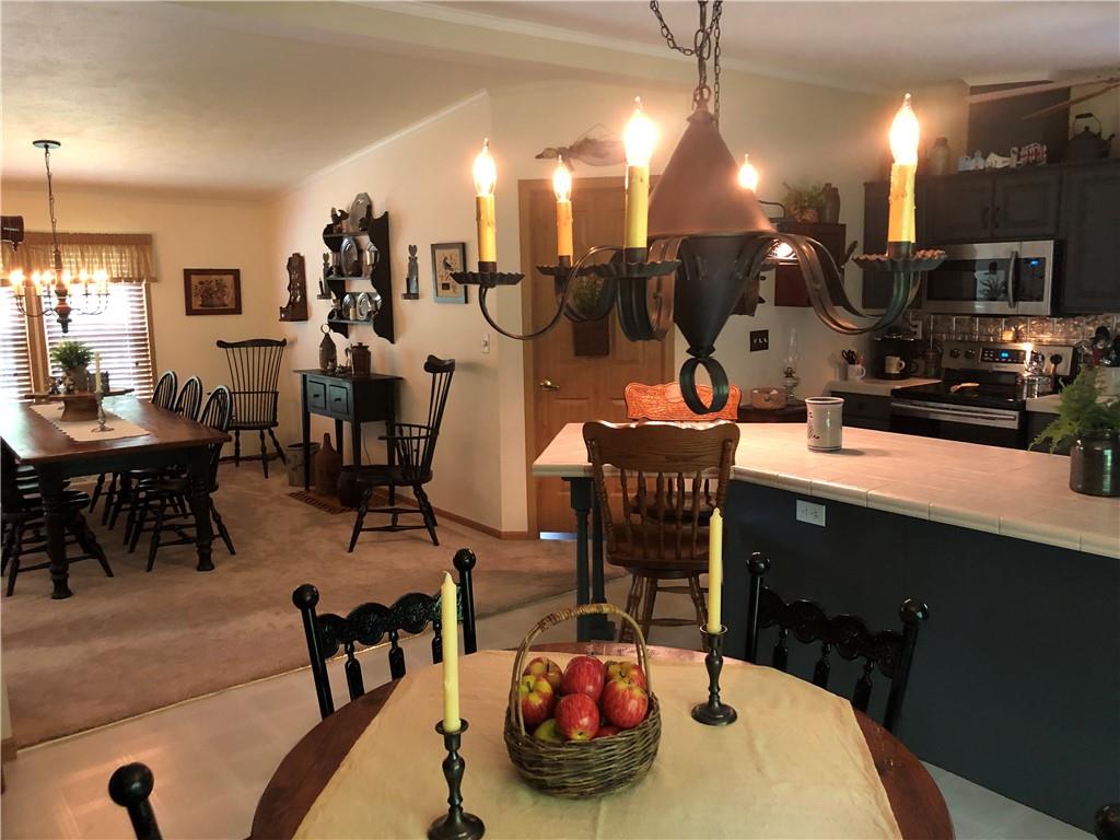 661 Nelson Road Farmington, PA 15437 - Photo 26 of 50 a room with table chairs and white walls
