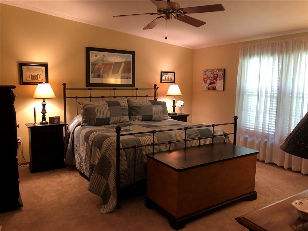 661 Nelson Road Farmington, PA 15437 - Photo 30 of 50 a bedroom with furniture and a lamp
