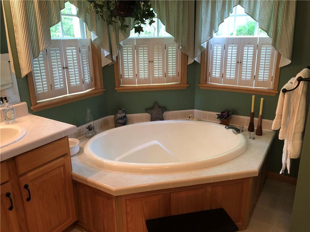 661 Nelson Road Farmington, PA 15437 - Photo 33 of 50 a bath tub sitting next to a window