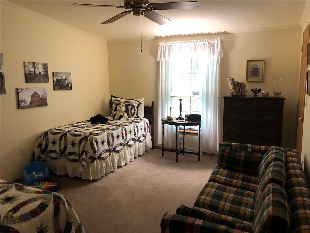 661 Nelson Road Farmington, PA 15437 - Photo 35 of 50 a bedroom with a bed and a flat screen tv