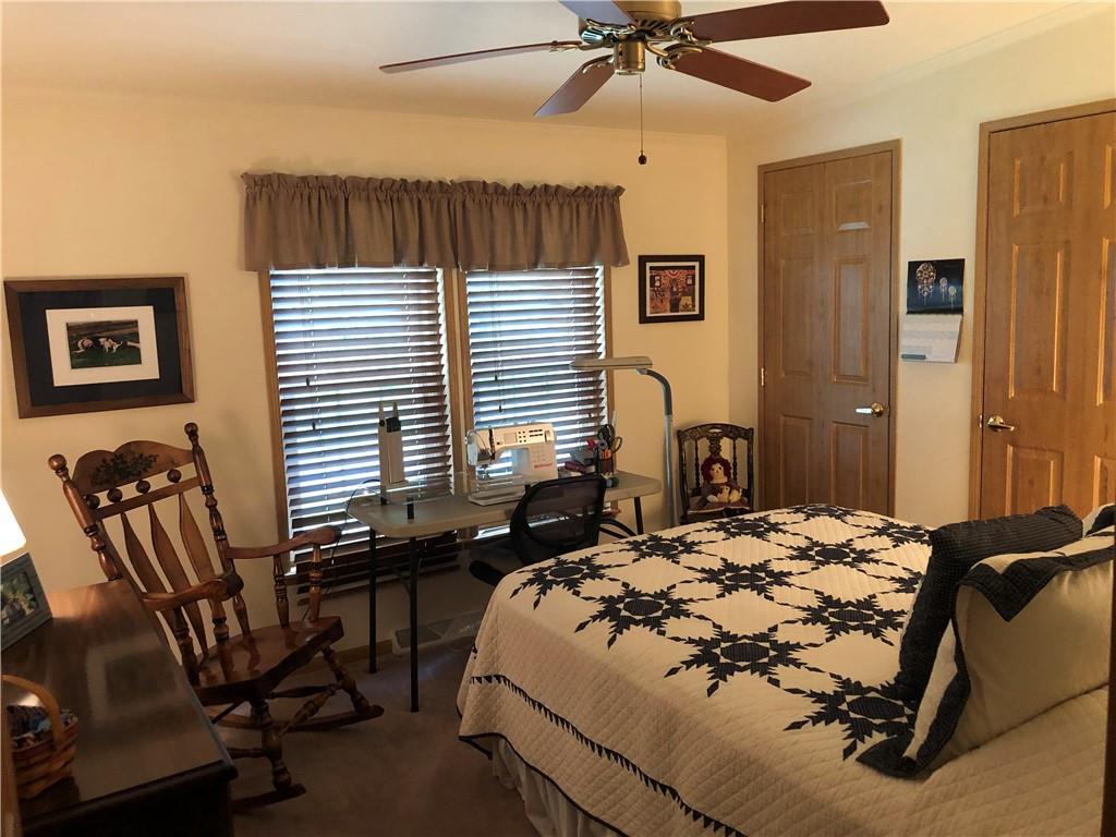 661 Nelson Road Farmington, PA 15437 - Photo 36 of 50 a bedroom with a bed a desk and chair