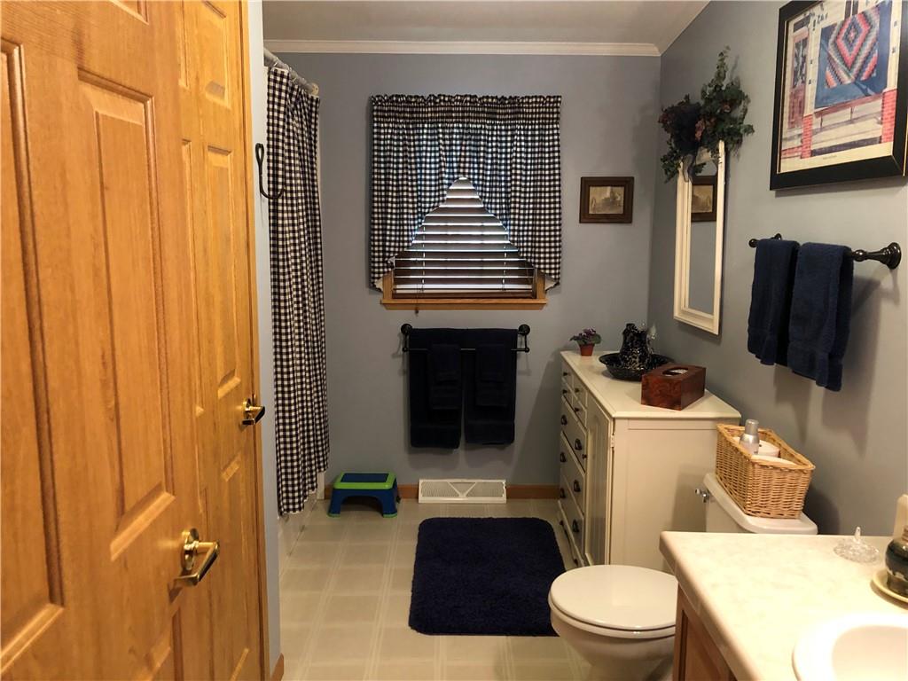 661 Nelson Road Farmington, PA 15437 - Photo 37 of 50 a bathroom with a toilet and a shower