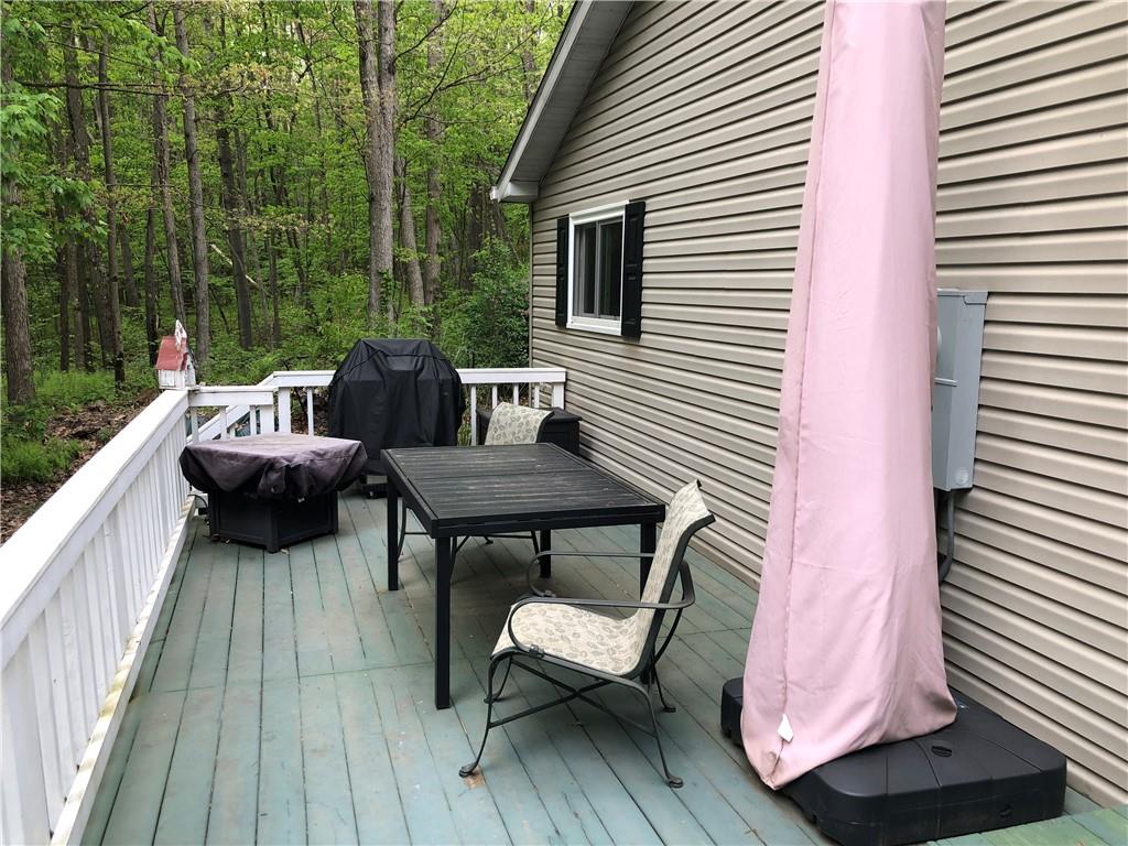 661 Nelson Road Farmington, PA 15437 - Photo 38 of 50 a view of a patio with a table and chairs