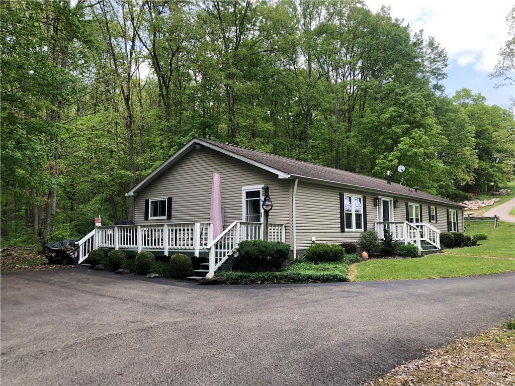 661 Nelson Road Farmington, PA 15437 - Photo 40 of 50 a view of a house with a yard and large trees