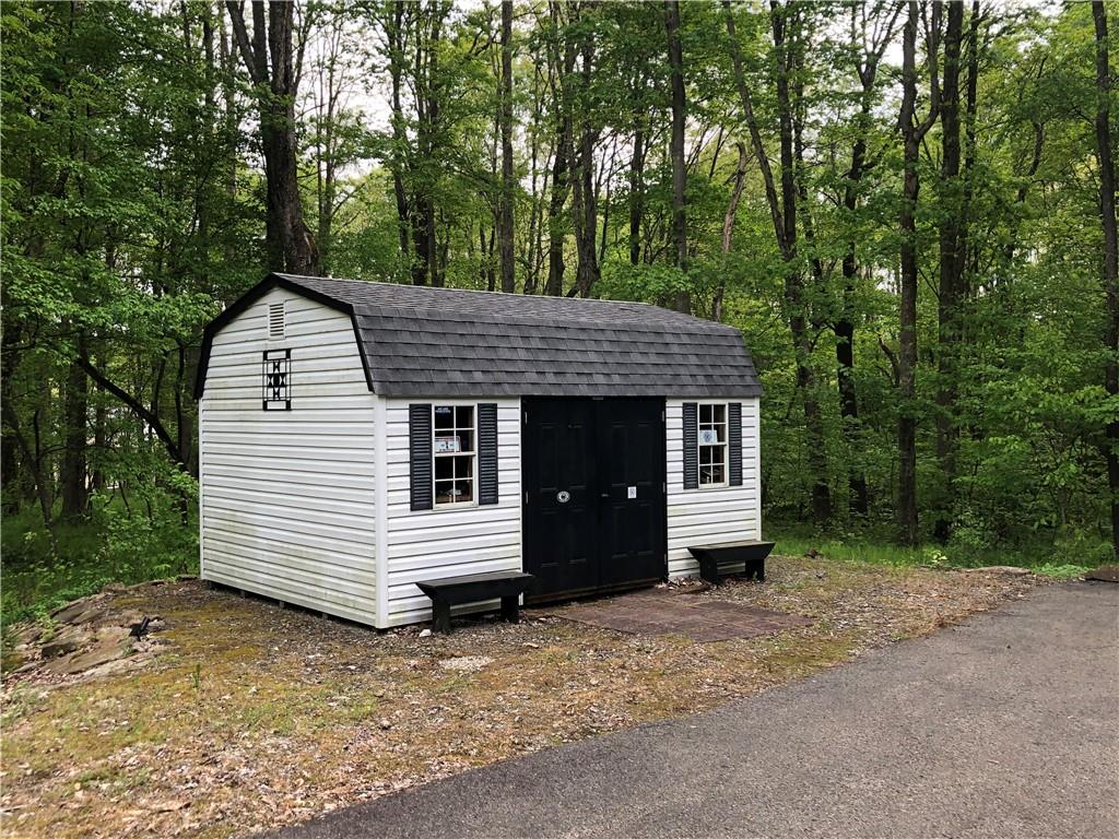 661 Nelson Road Farmington, PA 15437 - Photo 49 of 50 a view of a house with a yard and large tree