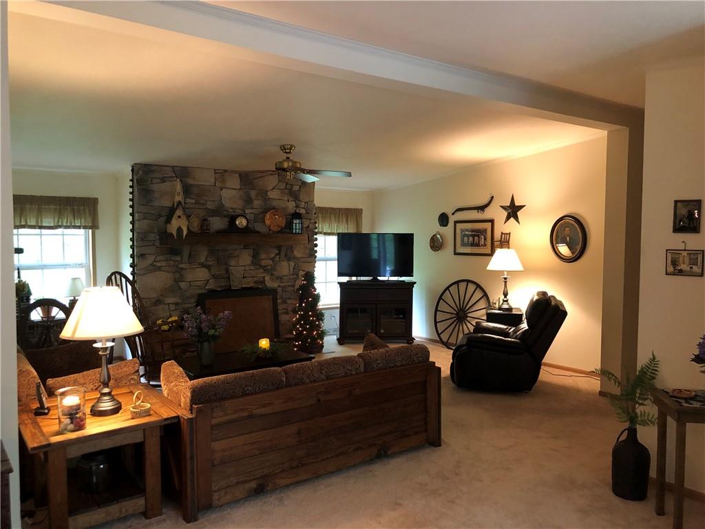 661 Nelson Road Farmington, PA 15437 - Photo 10 of 50 a living room with furniture and a fireplace