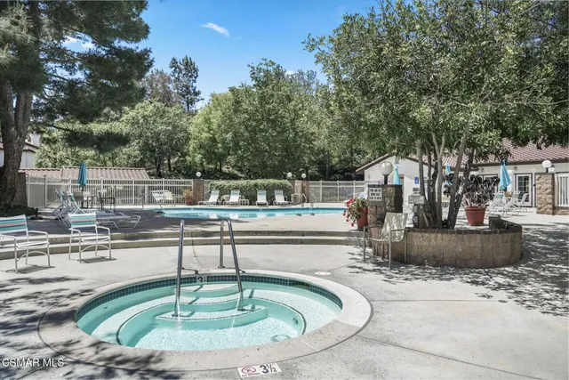 a house view with a fountain back yard