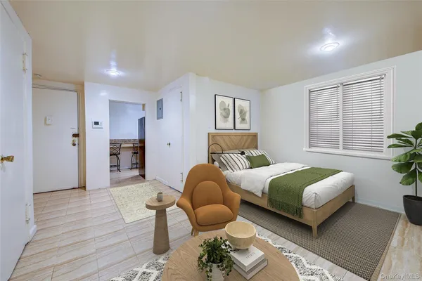 a bedroom with a bed and window