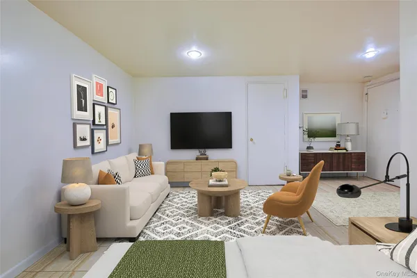 a living room with furniture and a flat screen tv