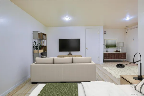 a living room with a couch and a flat screen tv