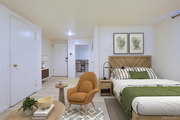 a bedroom with a bed and window