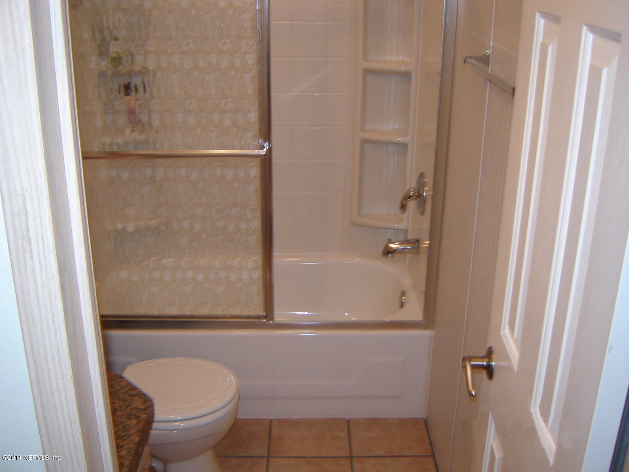 9361 Hipps Road Jacksonville, FL 32222 - Photo 19 of 21 a bathroom with a granite countertop sink toilet and shower