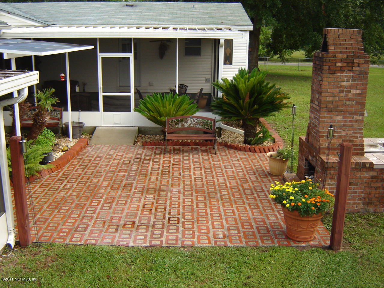 9361 Hipps Road Jacksonville, FL 32222 - Photo 8 of 21 a front view of a house with a garden