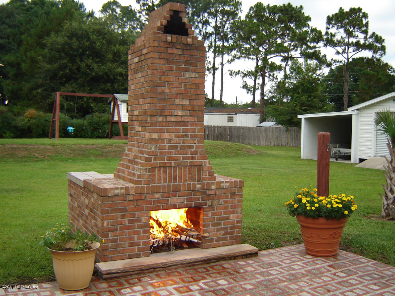 9361 Hipps Road Jacksonville, FL 32222 - Photo 9 of 21 a front view of a house with garden