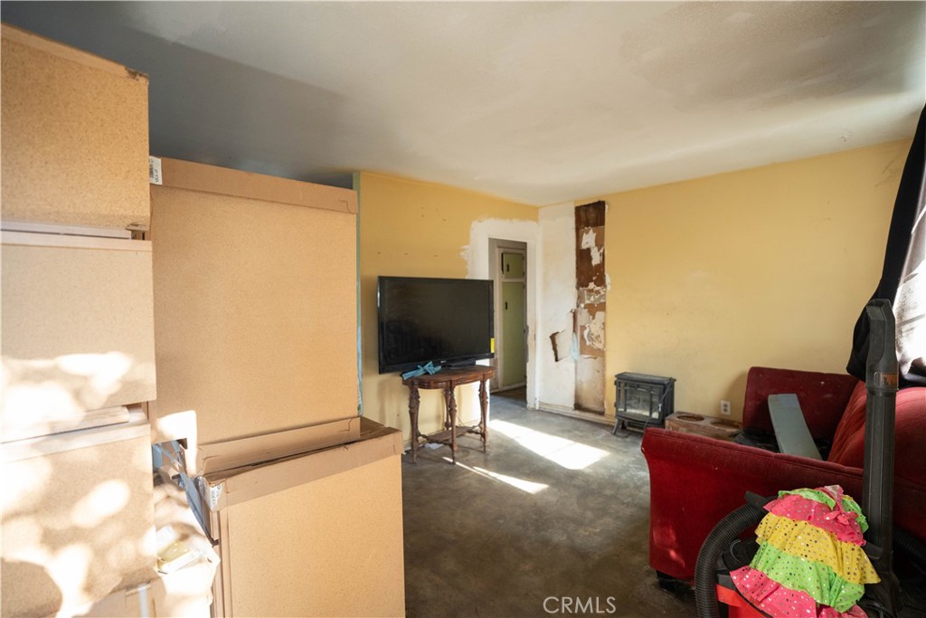 6174 Jurupa Avenue Riverside, CA 92504 - Photo 21 of 30 a living room with furniture and a flat screen tv