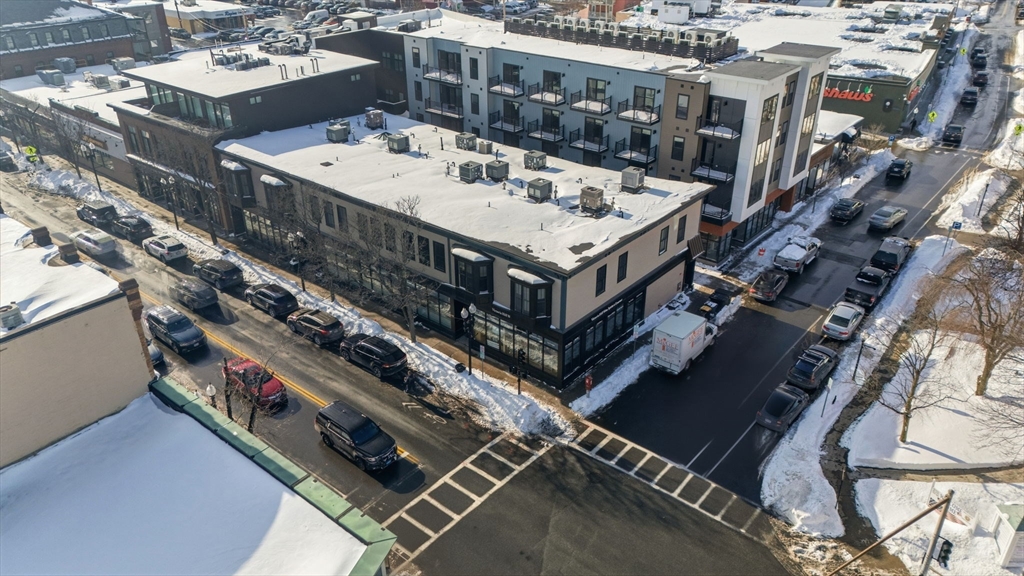 534 Main Street, Unit 11 Melrose, MA 02176 - Photo 12 of 16 a view of a balcony with a city street