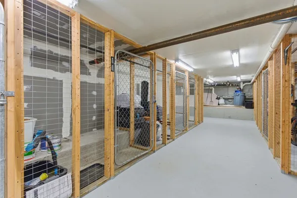 a view of a hallway with wooden shelves