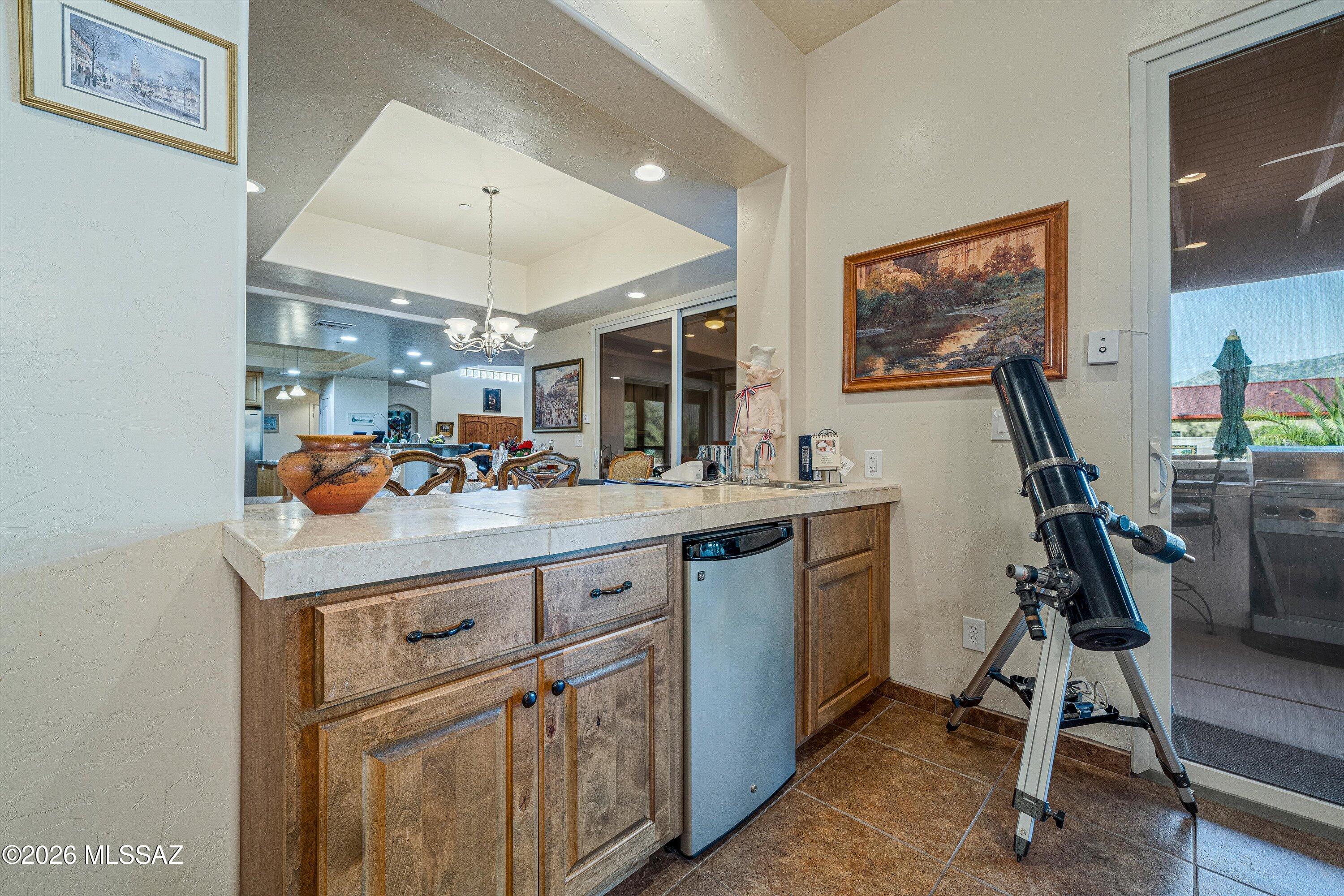 4677 East Rail N Road Tucson, AZ 85739 - Photo 21 of 48 Wetbar between dining room and recreation room