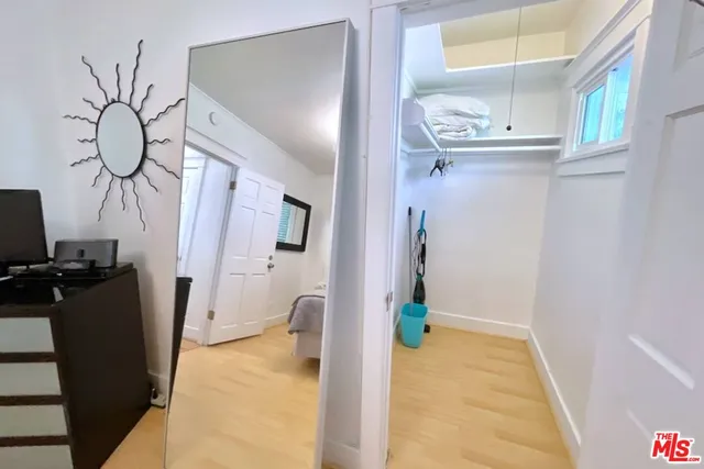 a bathroom with a granite countertop shower and a sink