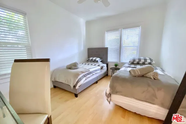 a bedroom with a bed and window