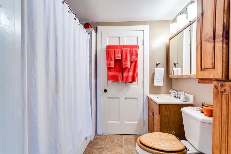 4307 McGinnis Road Corryton, TN 37721 - Photo 13 of 39 a bathroom with a sink toilet vanity and shower