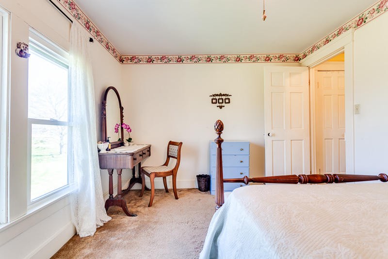 4307 McGinnis Road Corryton, TN 37721 - Photo 15 of 39 a bed room with a bed and a chair