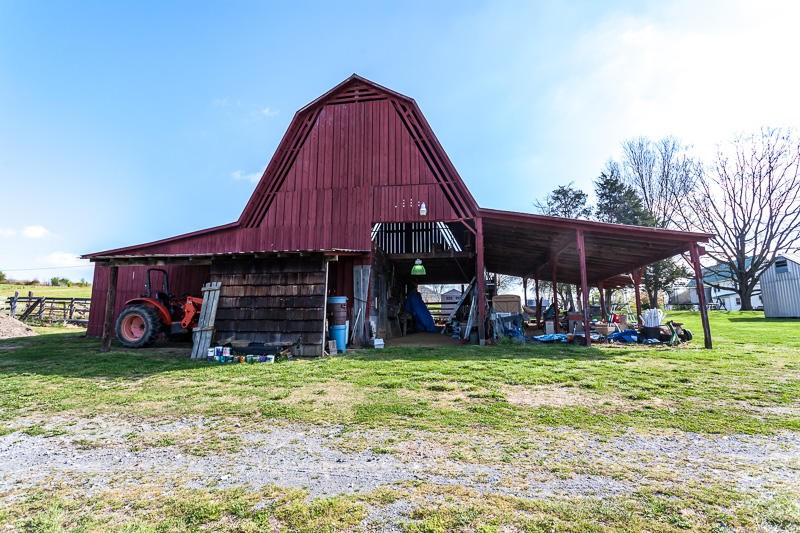 4307 McGinnis Road Corryton, TN 37721 - Photo 33 of 39 a view of a house with a yard and a garage