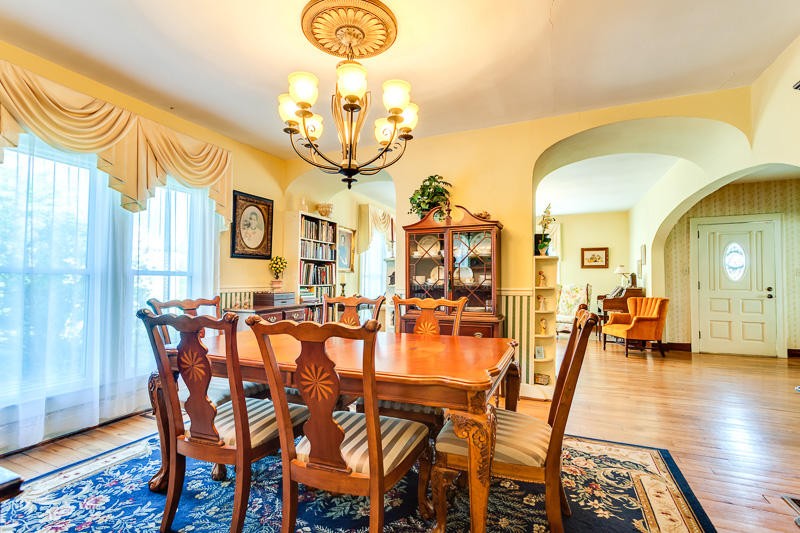 4307 McGinnis Road Corryton, TN 37721 - Photo 10 of 39 a dining room with furniture a chandelier and wooden floor