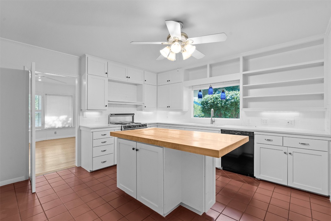 2606 Westover Road Austin, TX 78703 - Photo 15 of 38 a kitchen with a stove a sink and a refrigerator