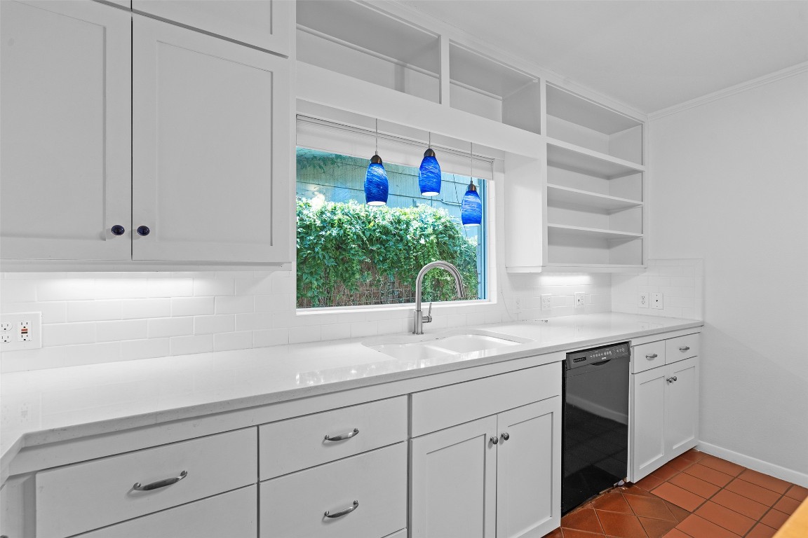 2606 Westover Road Austin, TX 78703 - Photo 19 of 38 a kitchen with a sink and cabinets