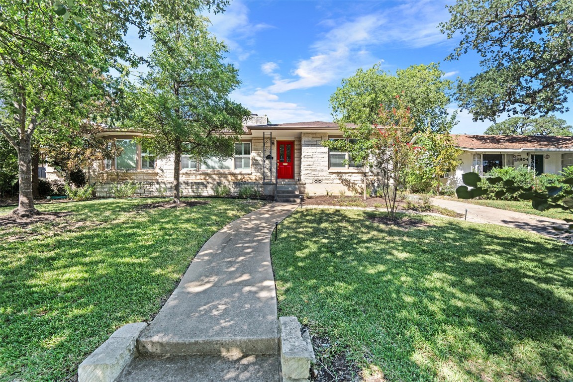 2606 Westover Road Austin, TX 78703 - Photo 2 of 38 a front view of a house with a yard and fountain