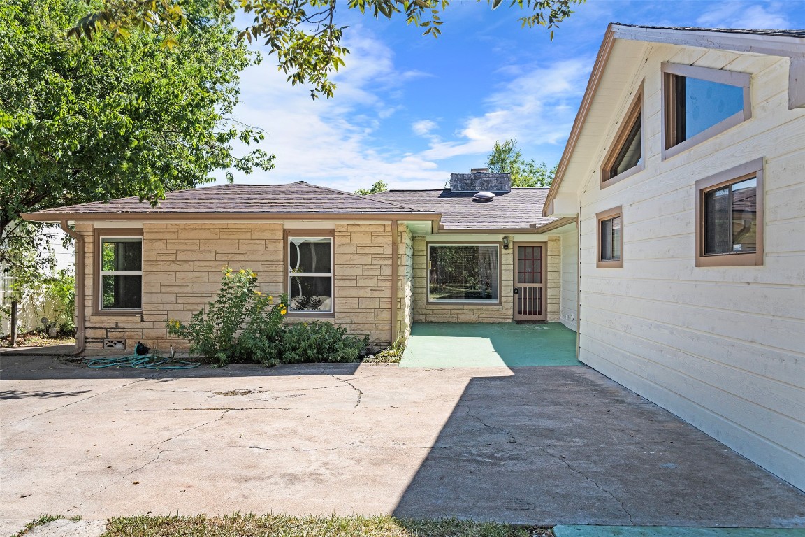 2606 Westover Road Austin, TX 78703 - Photo 33 of 38 a front view of a house with a yard and potted plants