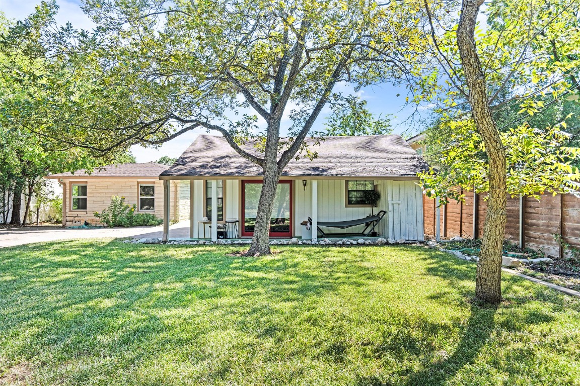 2606 Westover Road Austin, TX 78703 - Photo 38 of 38 a front view of a house with a garden and trees