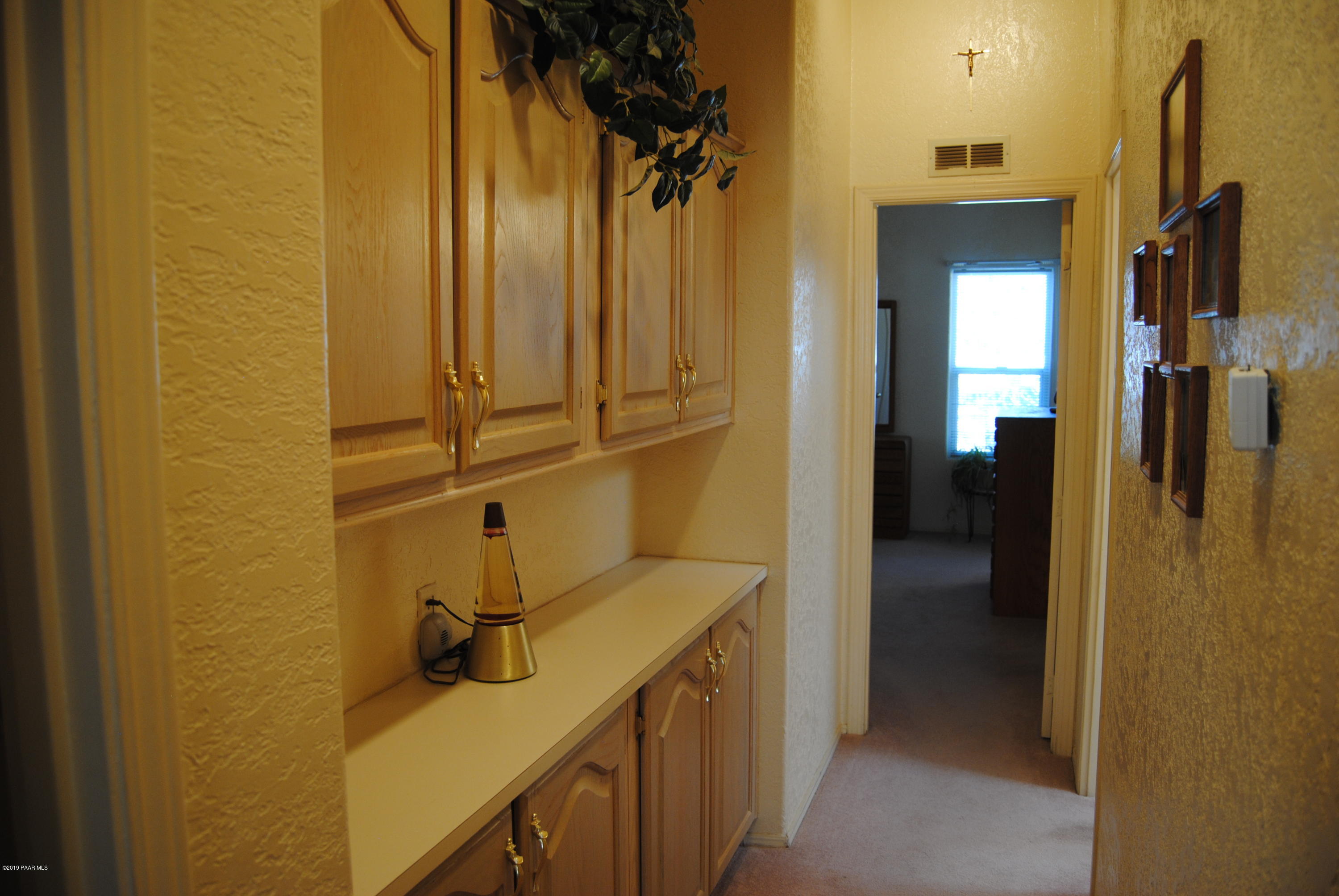 10378 Brahma Road Dewey, AZ 86327 - Photo 31 of 52 031_Hallway With Cabinets