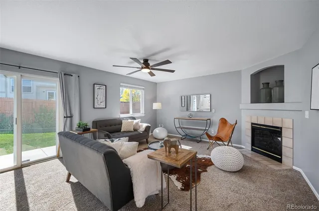 a living room with furniture fireplace and a flat screen tv