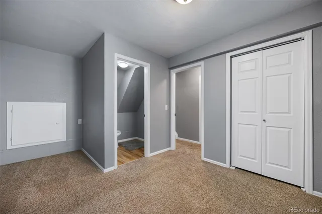 an empty room with closet area