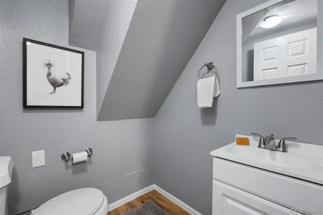 a bathroom with a toilet and a sink