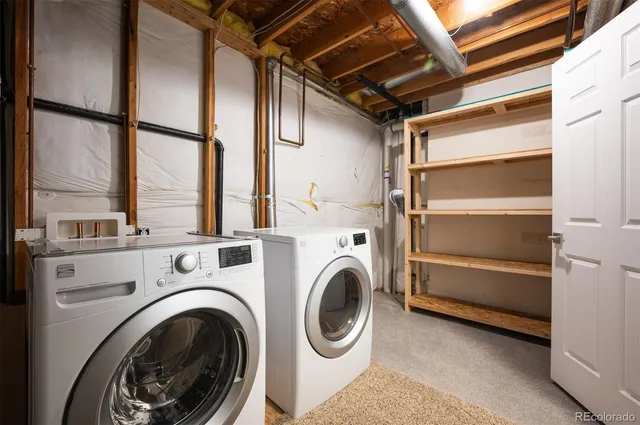 a view of a storage & utility room with washer and dryer