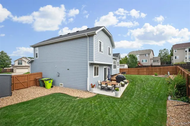 a backyard of a house with seating space