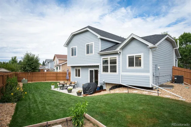 a front view of house with yard and outdoor seating