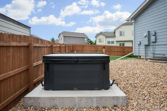a view of residential house with wooden fence