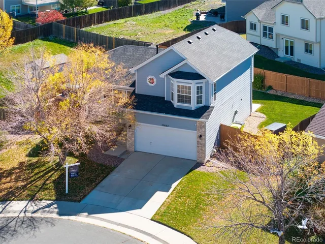 a aerial view of a house with swimming pool