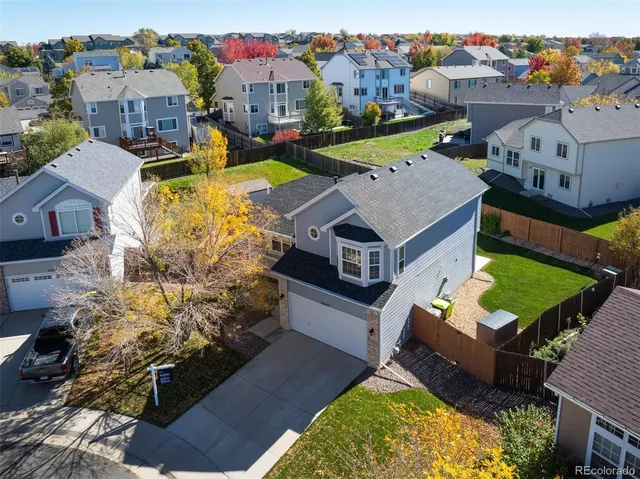 an aerial view of a house with a big yard