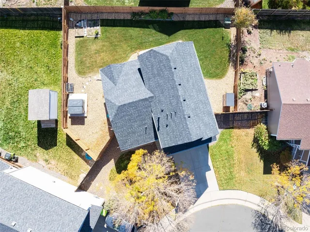 swimming pool view with a floor to ceiling window and wooden floor