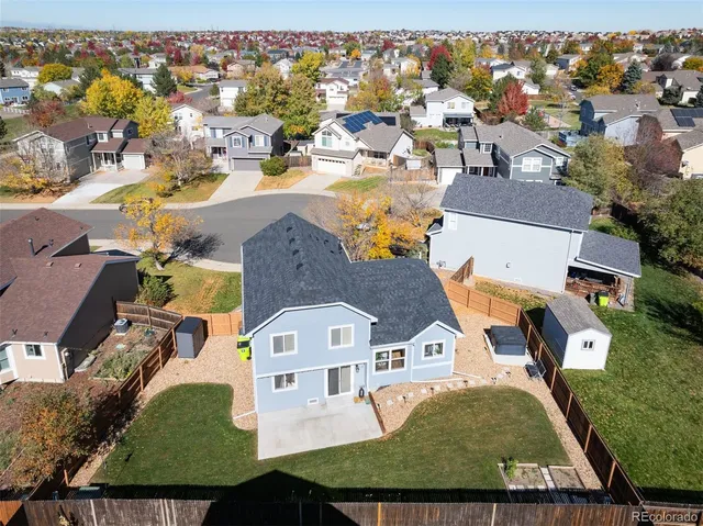 an aerial view of residential houses with outdoor space