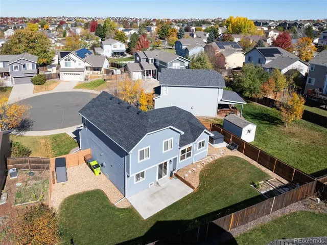 an aerial view of residential houses with outdoor space