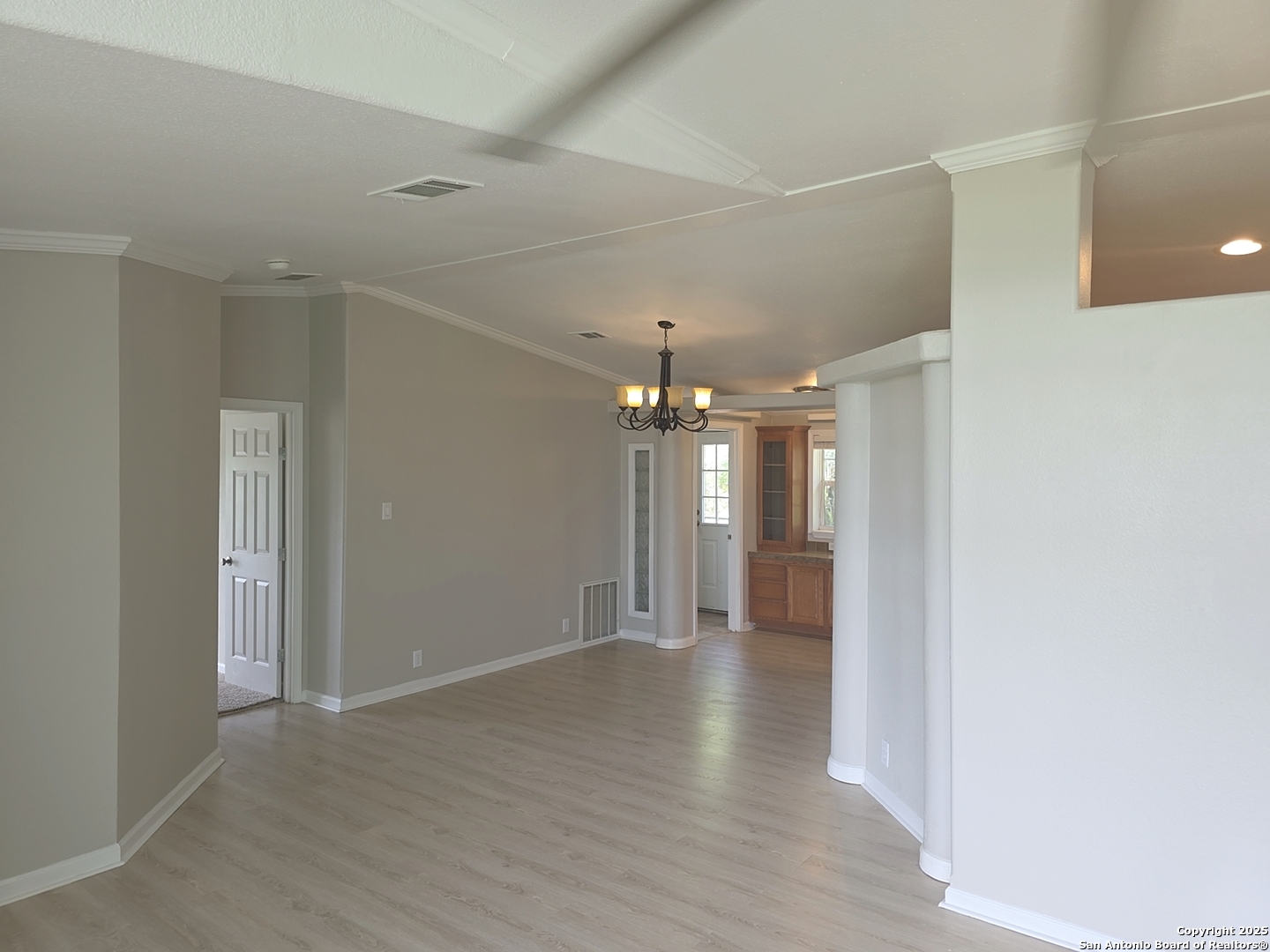 7940 County Road 279 Rio Medina, TX 78066 - Photo 12 of 33 a view of an empty room with wooden floor