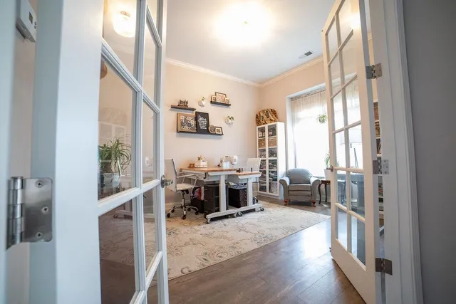 a view of a livingroom with furniture and a window