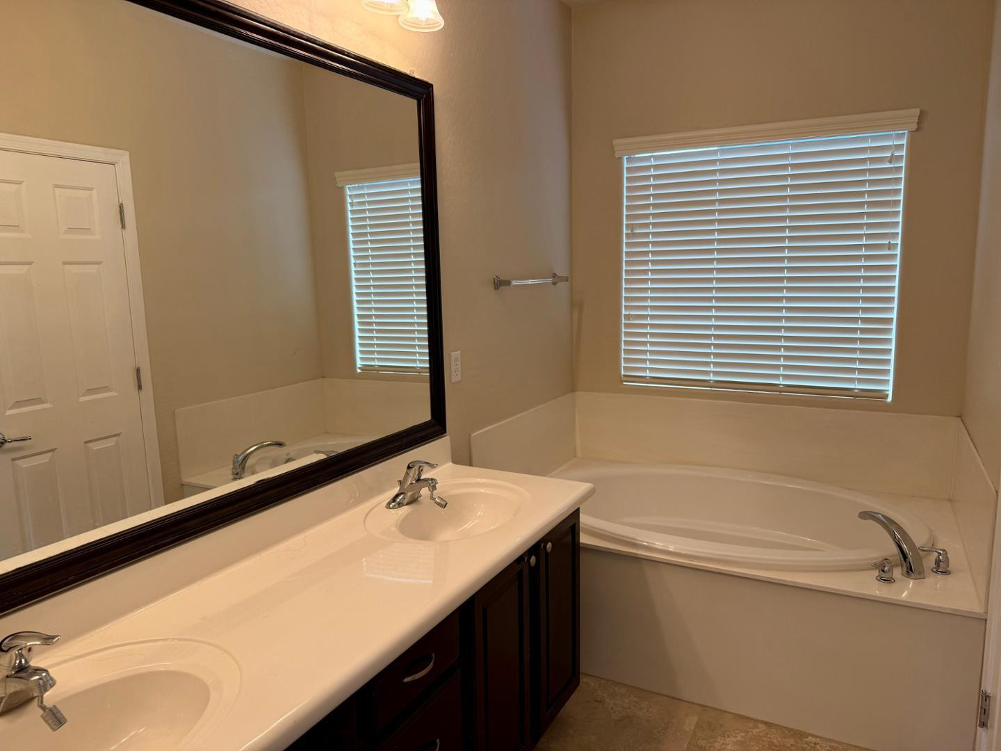 1929 West Black Hill Road Phoenix, AZ 85085 - Photo 23 of 26 a bathroom with a granite countertop sink and a bathtub